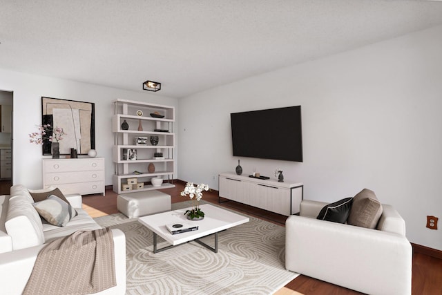 living room featuring hardwood / wood-style floors and a textured ceiling