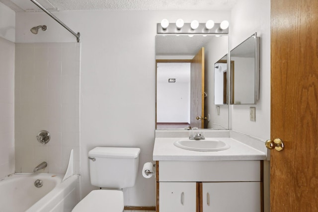 full bathroom featuring shower / washtub combination, a textured ceiling, toilet, and vanity