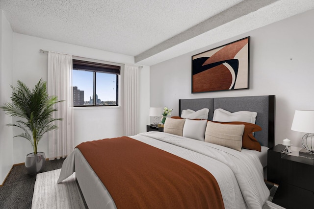 carpeted bedroom featuring a textured ceiling