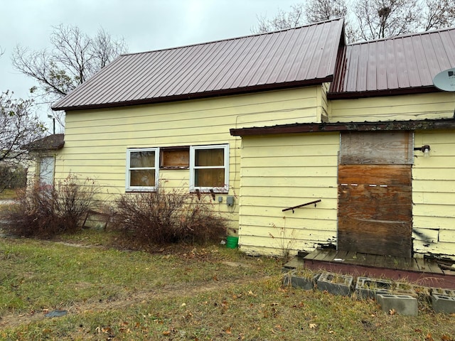 view of home's exterior featuring a yard