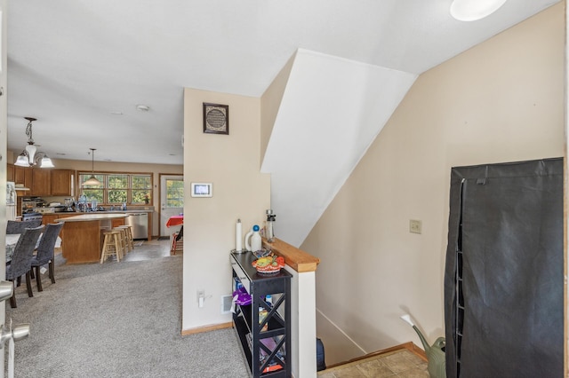 interior space featuring carpet and lofted ceiling