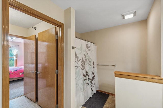 bathroom featuring a shower with curtain