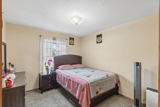 carpeted bedroom with a textured ceiling