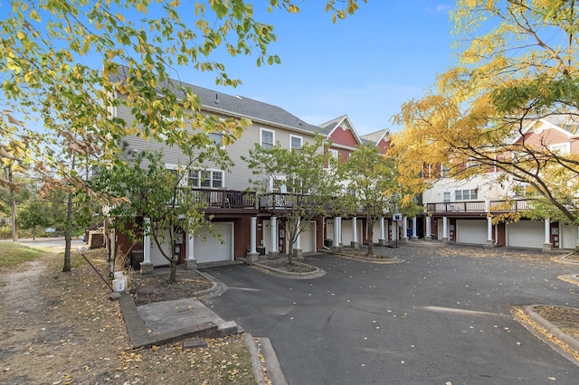 view of front of home featuring a garage and a deck