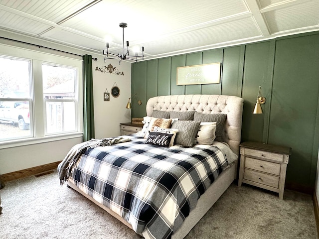 carpeted bedroom with a chandelier