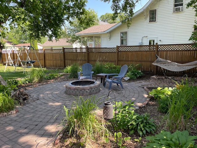 view of patio with a fire pit