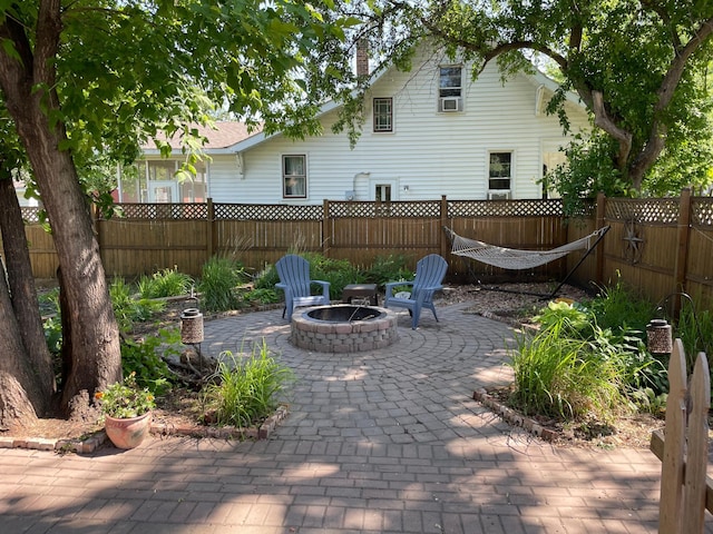 view of patio / terrace featuring an outdoor fire pit