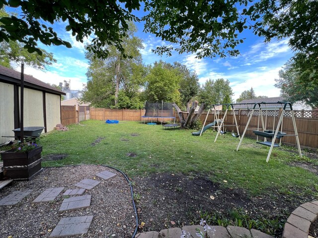 820 Labree Ave N, Thief River Falls, MN 56701 - view of yard featuring a trampoline and a playground
