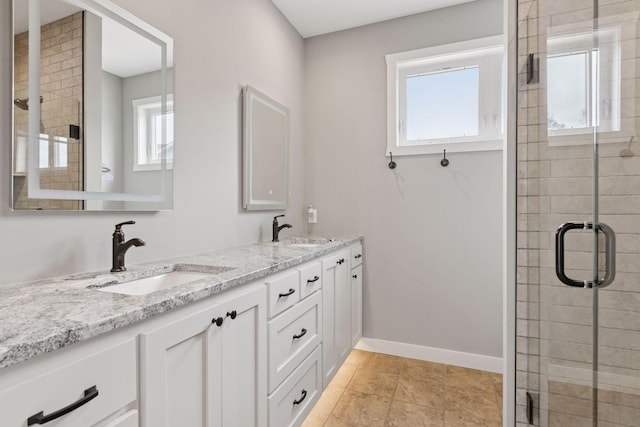 12770 196th Ave NW, Elk River, MN 55330 - full bath with a shower stall, double vanity, and baseboards