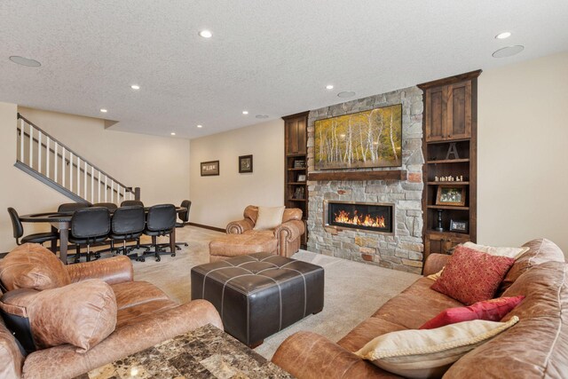 12770 196th Ave NW, Elk River, MN 55330 - living area with light carpet, a textured ceiling, recessed lighting, stairway, and a fireplace