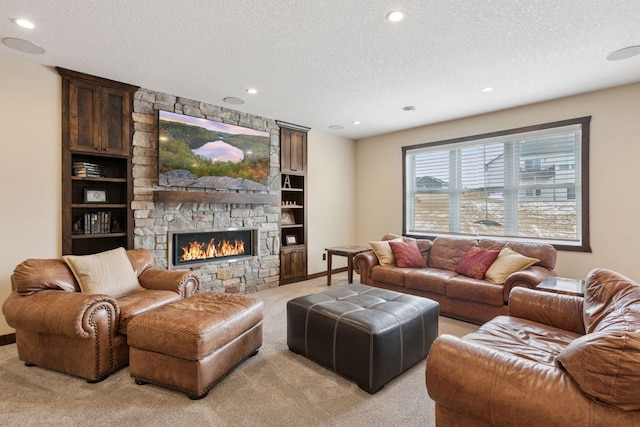 12770 196th Ave NW, Elk River, MN 55330 - living area with light colored carpet, a textured ceiling, a stone fireplace, recessed lighting, and baseboards