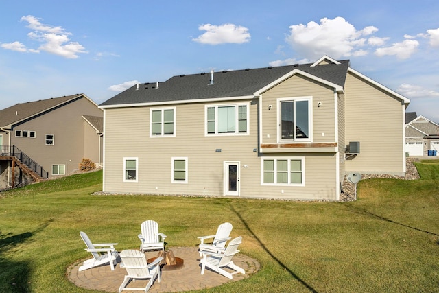 12770 196th Ave NW, Elk River, MN 55330 - back of property with an outdoor fire pit, a patio, and a yard