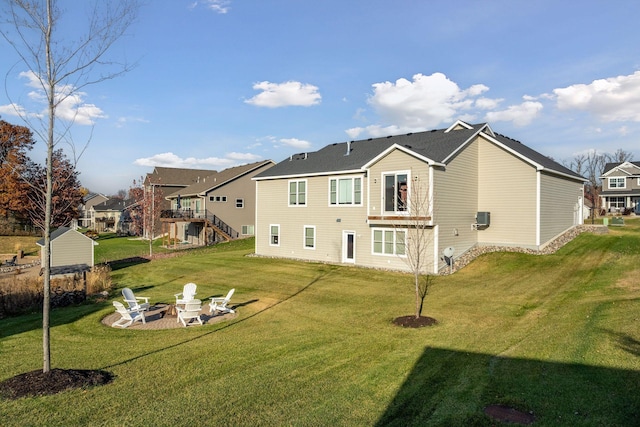 12770 196th Ave NW, Elk River, MN 55330 - back of house with a fire pit, a yard, and a residential view