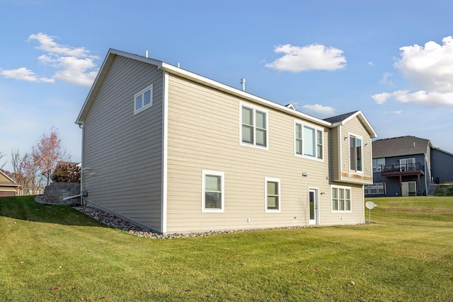 12770 196th Ave NW, Elk River, MN 55330 - back of house featuring a lawn
