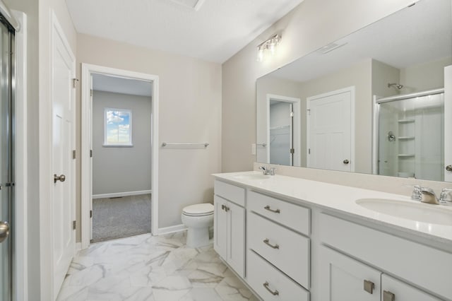 bathroom with walk in shower, vanity, toilet, and a textured ceiling