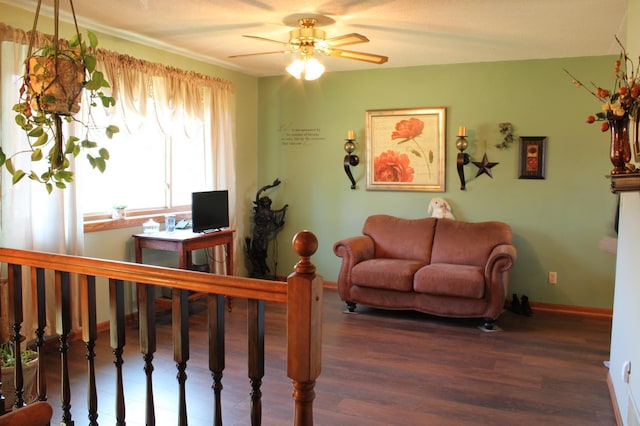 living room featuring dark wood-style floors, ceiling fan, and baseboards