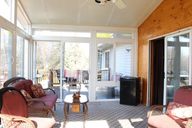 sunroom / solarium with lofted ceiling and ceiling fan