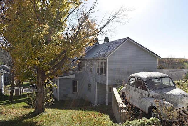 view of property exterior featuring a yard