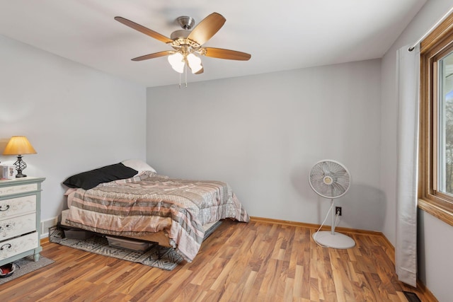 bedroom featuring ceiling fan and light wood-type flooring