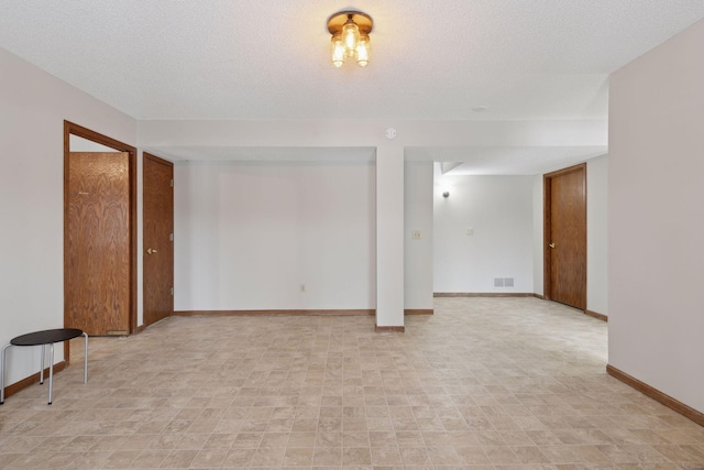 basement with a textured ceiling