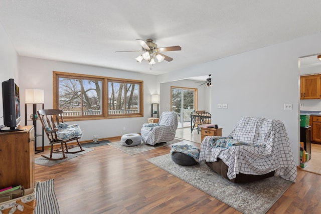 sitting room featuring hardwood / wood-style flooring and ceiling fan