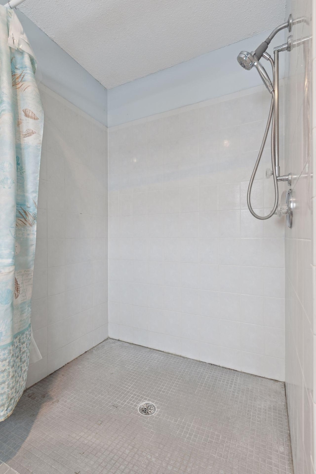 unfurnished room featuring a textured ceiling