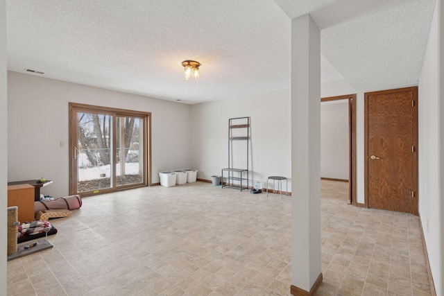 interior space with a textured ceiling