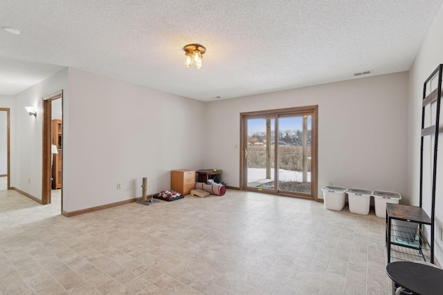 interior space featuring a textured ceiling