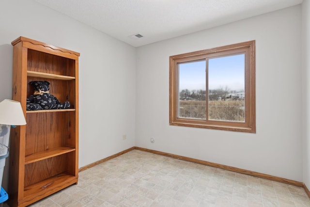 empty room with a textured ceiling