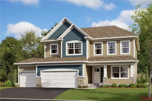 craftsman-style house featuring a front yard and a garage