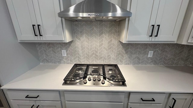 kitchen with decorative backsplash, stainless steel gas cooktop, and exhaust hood