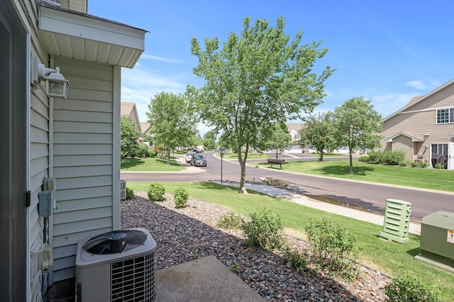 view of yard featuring central air condition unit