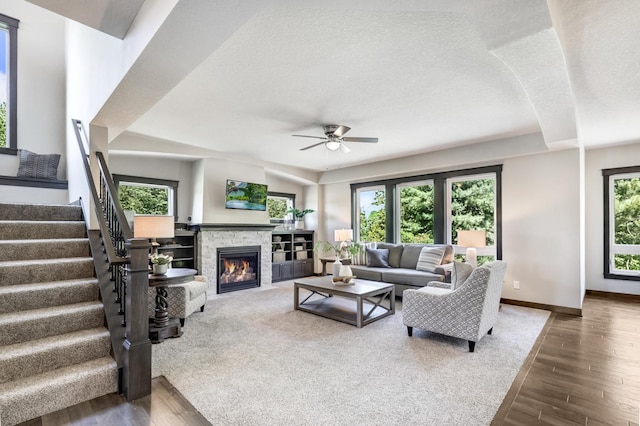 living room featuring dark hardwood / wood-style floors and a healthy amount of sunlight