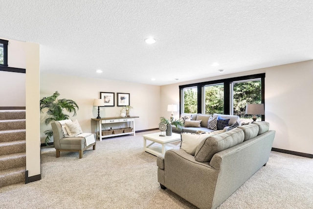 carpeted living room with a textured ceiling