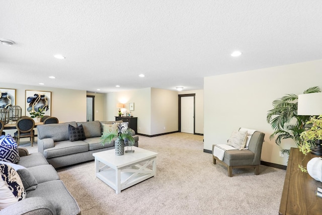 living room featuring a textured ceiling and light carpet