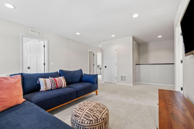 living room with visible vents, recessed lighting, baseboards, and carpet floors