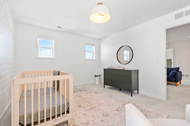 bedroom with visible vents, baseboards, and carpet flooring