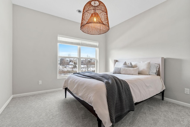 carpeted bedroom with baseboards