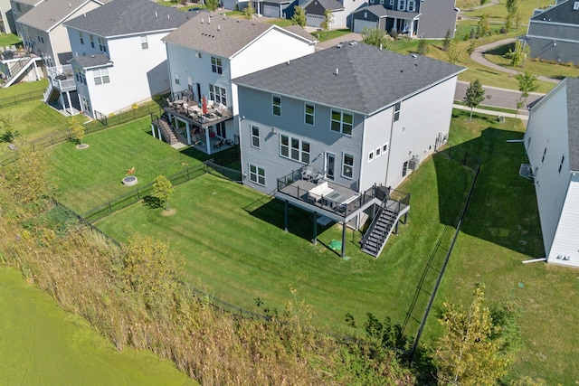 birds eye view of property with a residential view