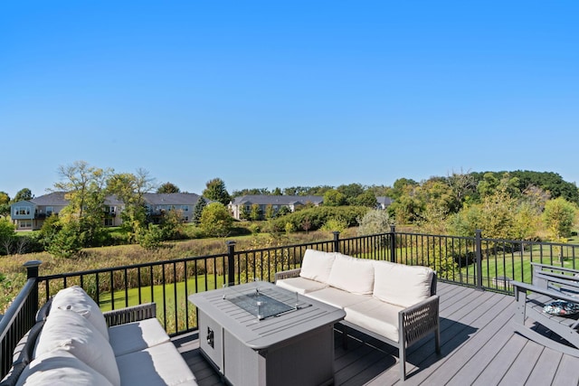 wooden deck featuring an outdoor living space