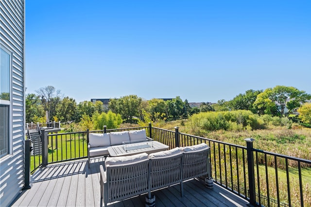 wooden terrace featuring outdoor lounge area