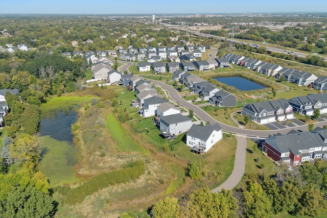 bird's eye view featuring a residential view and a water view