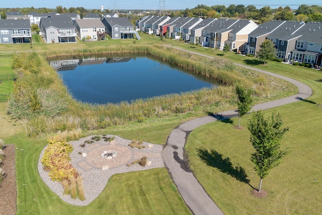 drone / aerial view featuring a residential view and a water view