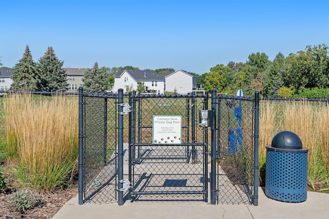 view of gate with fence