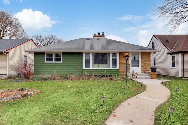 ranch-style home with a front yard