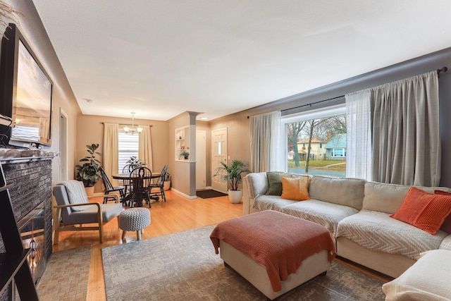 living room featuring a chandelier and hardwood / wood-style flooring