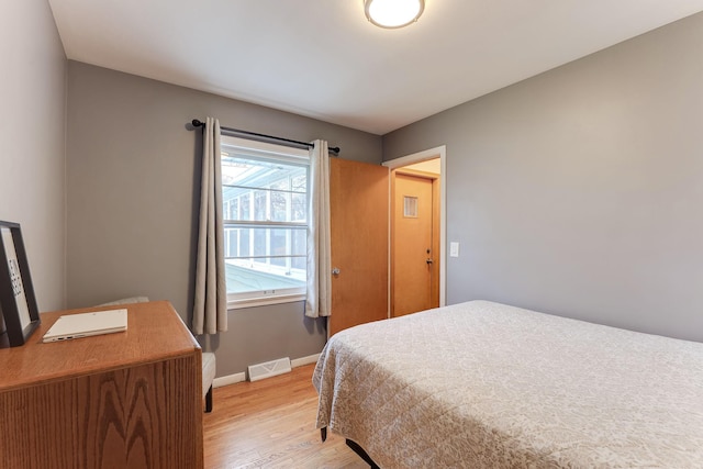 bedroom with light wood-type flooring