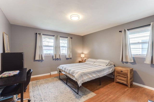 bedroom featuring hardwood / wood-style floors