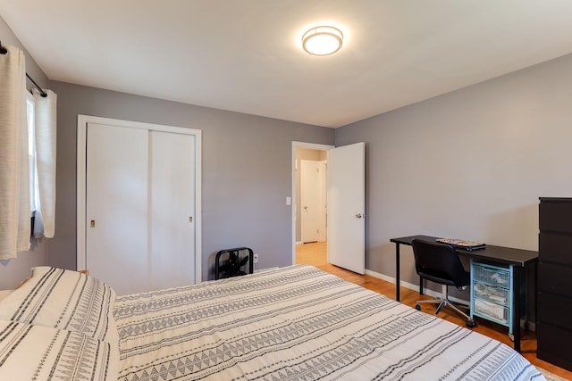 bedroom featuring a closet and hardwood / wood-style floors