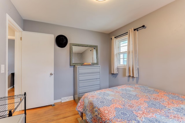 bedroom with light hardwood / wood-style flooring